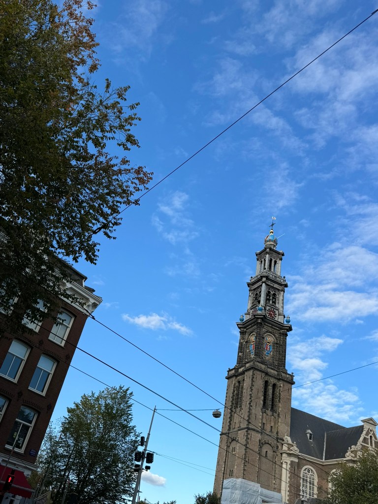 Old church steeple with blue skies in Amsterdam, The Netherlands