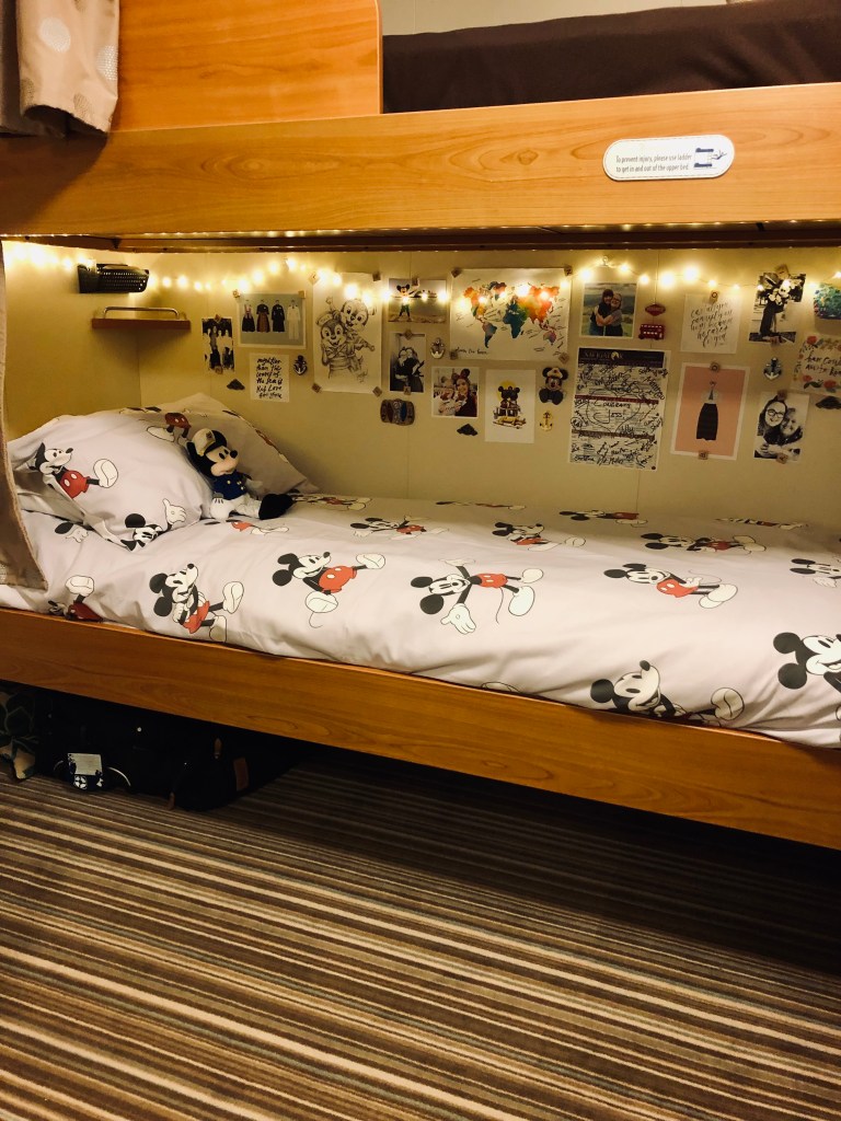 Disney Cruise Line Crew Cabin bunk bed with fairy lights and mickey quilt