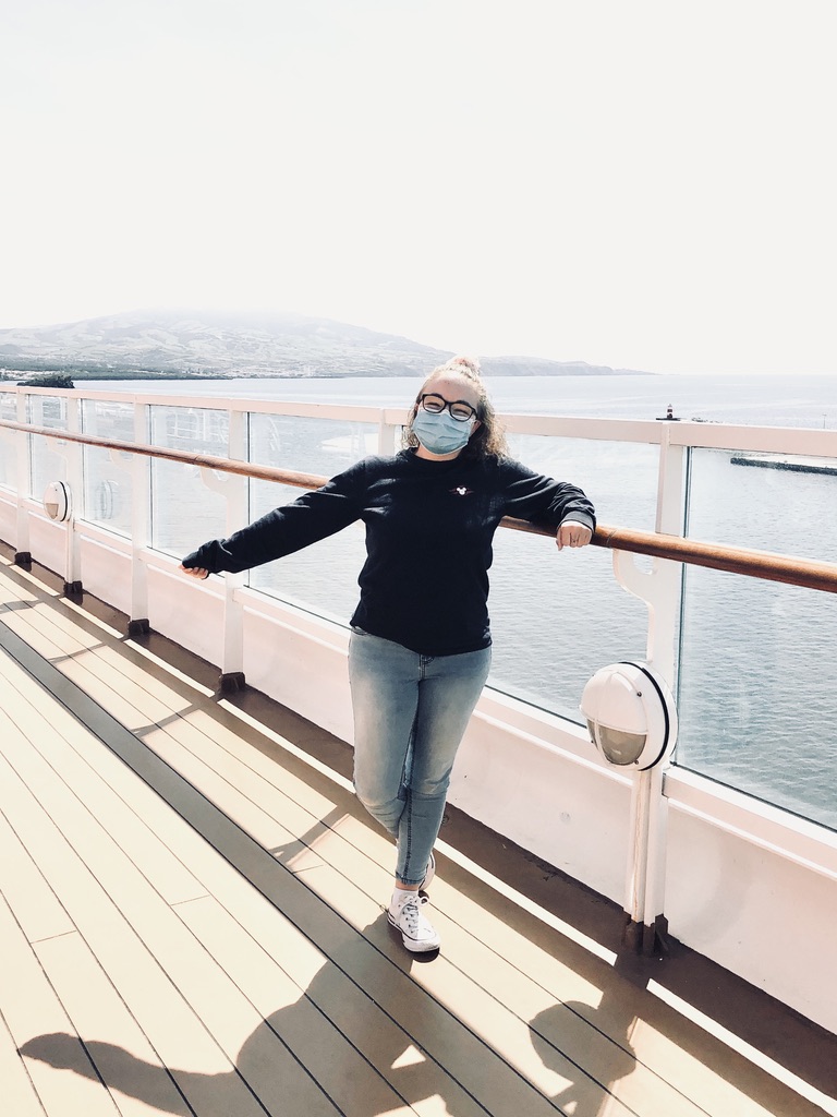 Girl in face mask on disney cruise ship deck