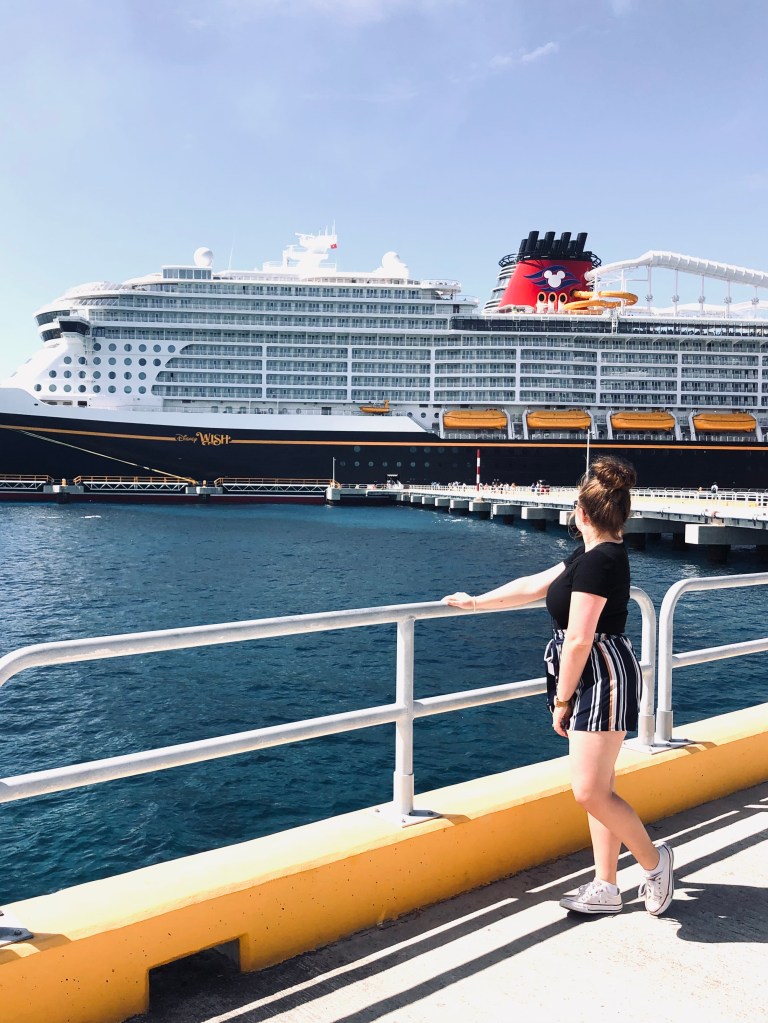 Girl looking back at disney cruise ship in port Cozumel, Mexico
