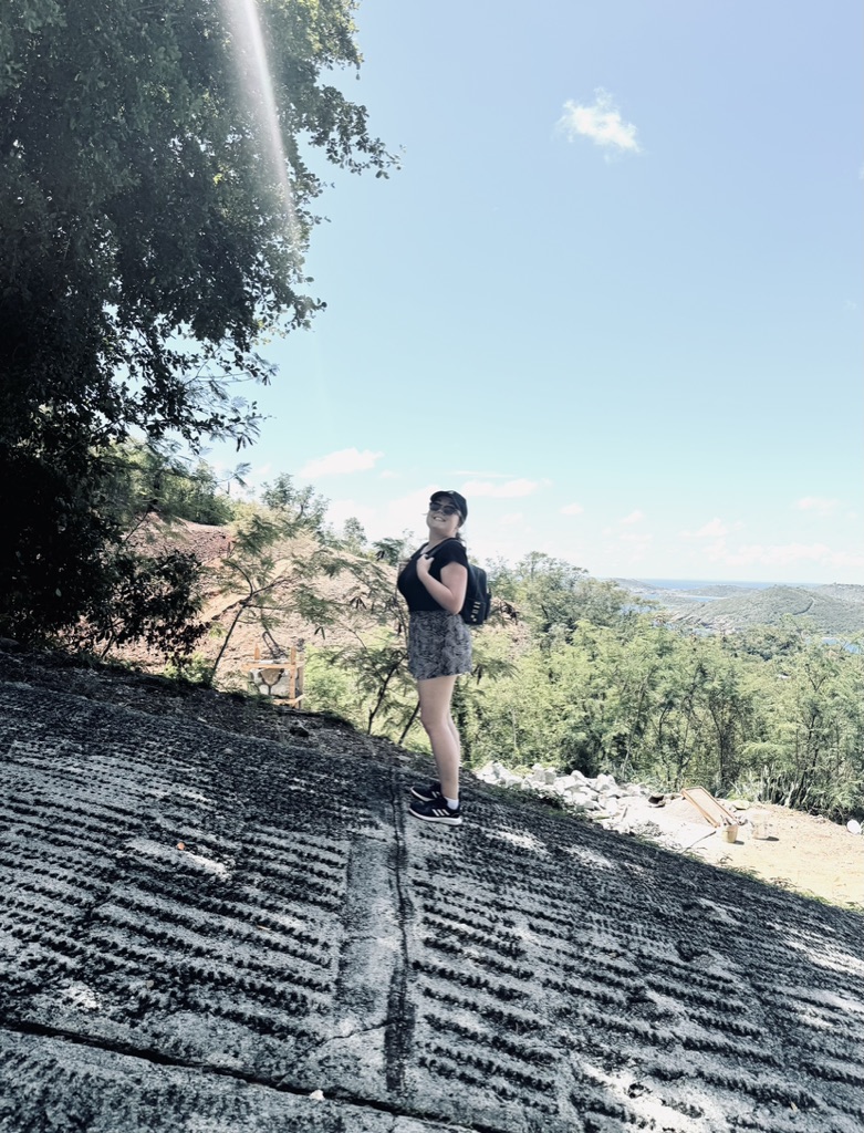 Girl standing on steep road leading to Paradise Point at St Thomas.