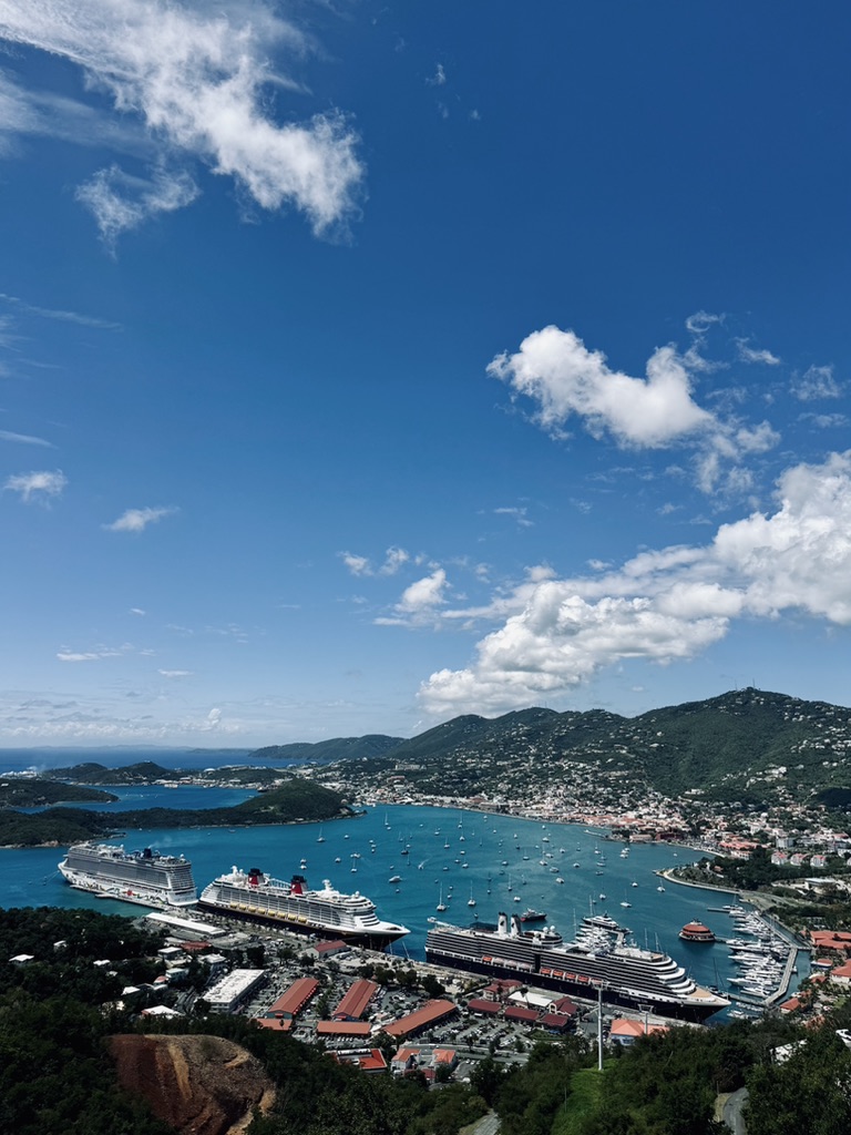 View of St Thomas from Paradise Point observation deck. Ocean, islands and disney cruise ship in the distance.
