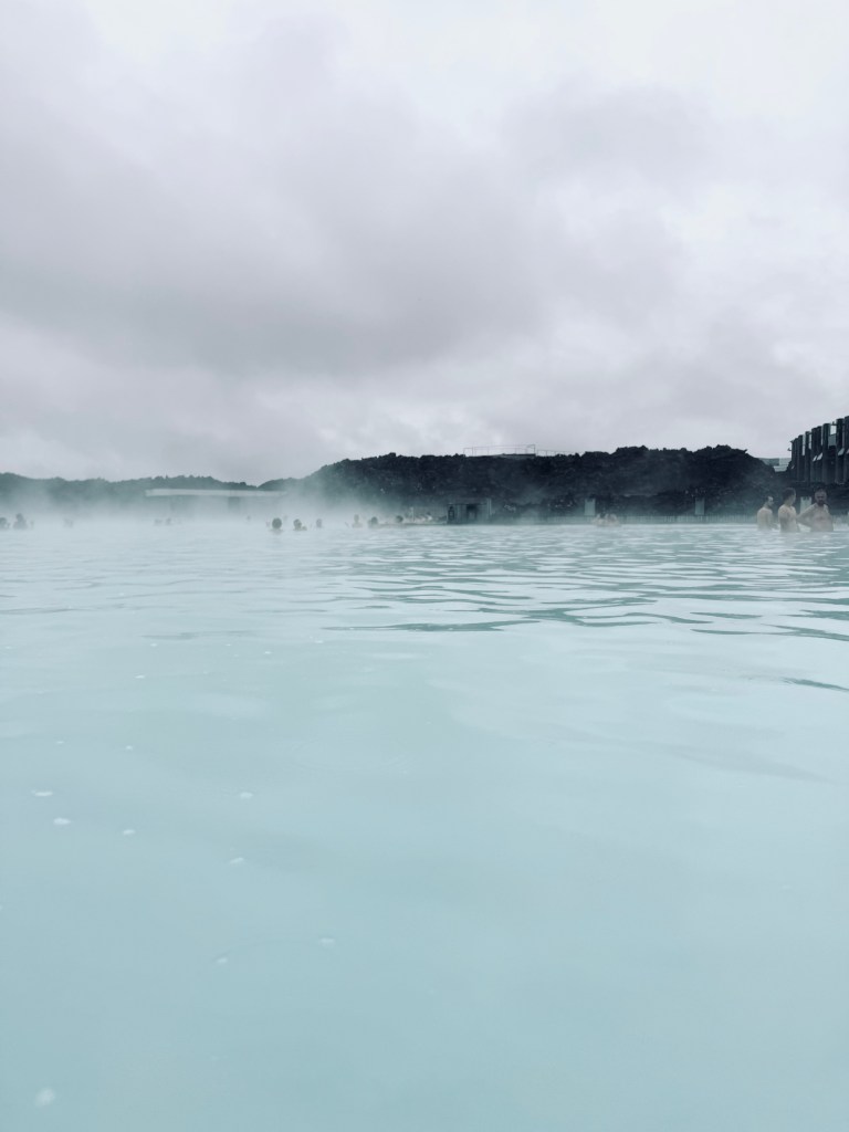 Milky blue water pools with steam at Blue Lagoon, Iceland