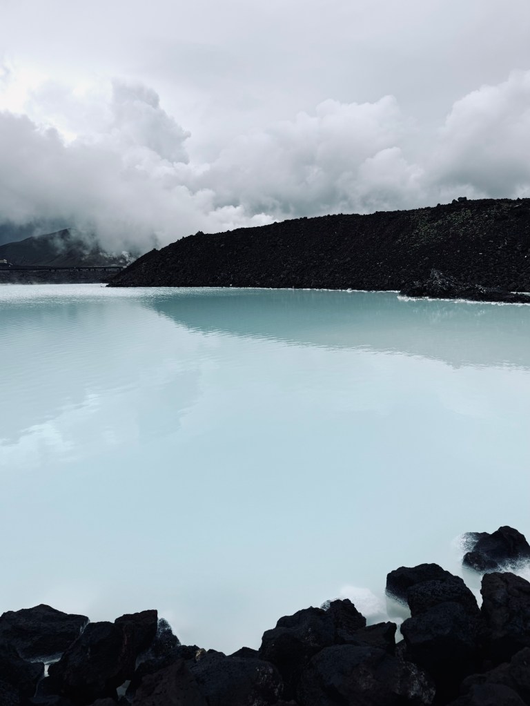 Milky blue water pools with steam at Blue Lagoon, Iceland
