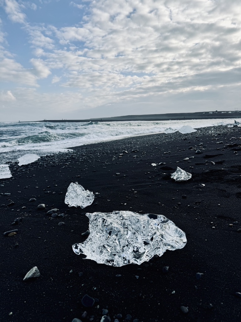 Big chunks of ice washed up on black sand beach at Diamond Beach, Iceland