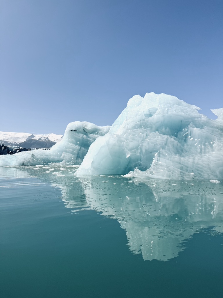 Bright blue icebergs floating on the blue waters of Jökulsárlón Glacier Lagoon, Iceland
