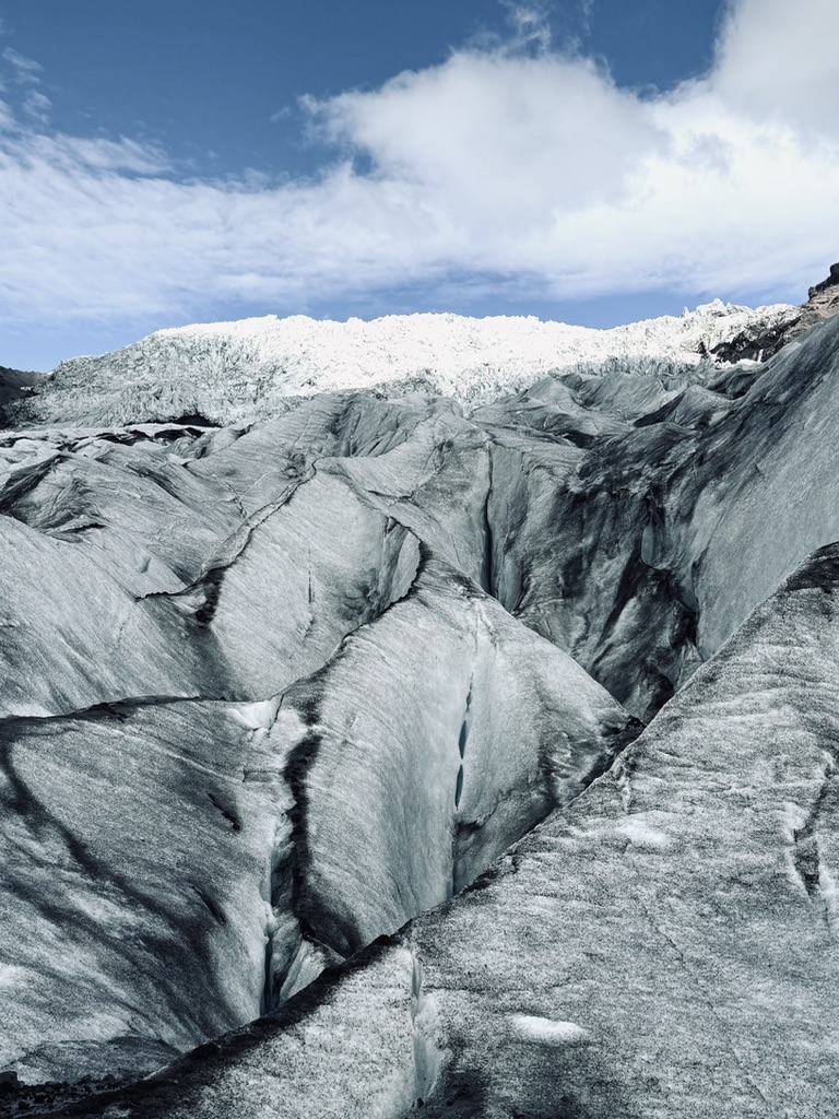 Big glacier with ash on ice at Skaftafell Glacier, Iceland