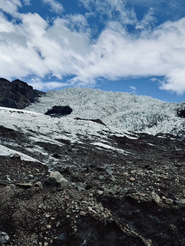 View of rocks and icy glacier on sunny day at Skaftafell Glacier, Iceland