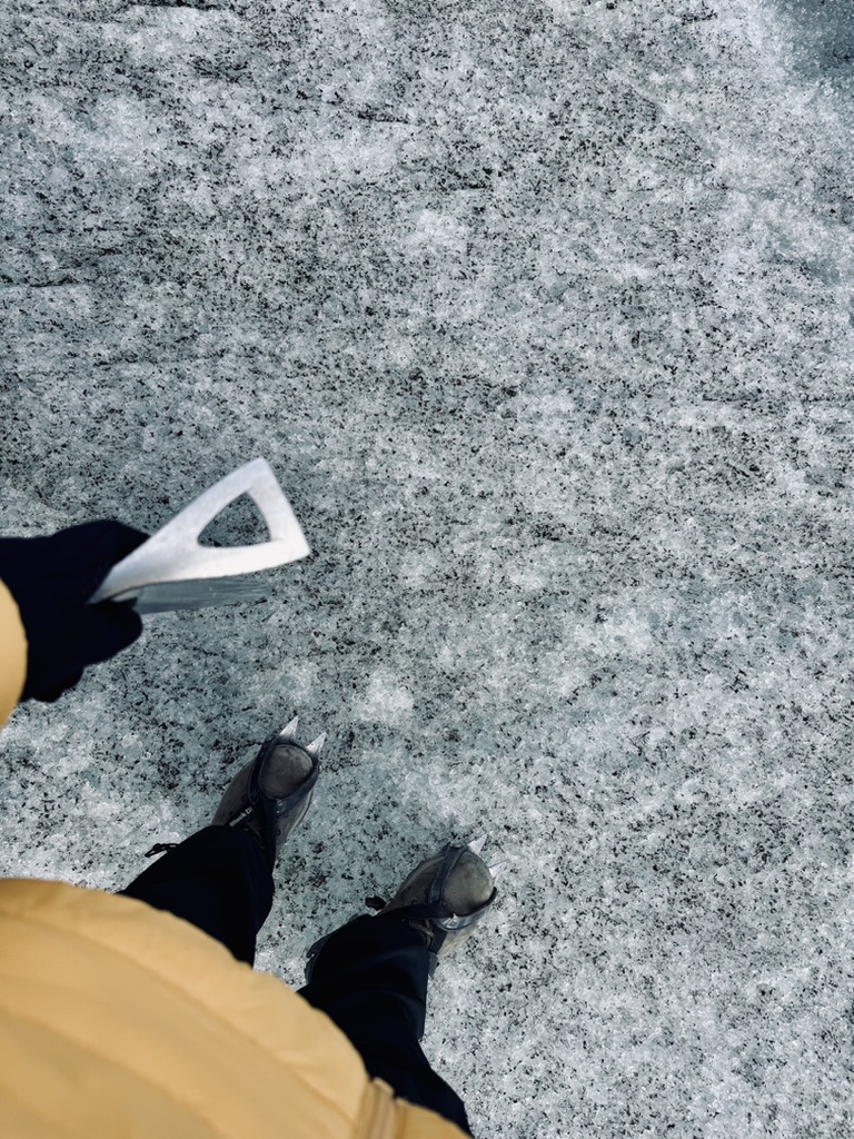 Ice Pick and crampons standing on ice at Skaftafell Glacier, Iceland