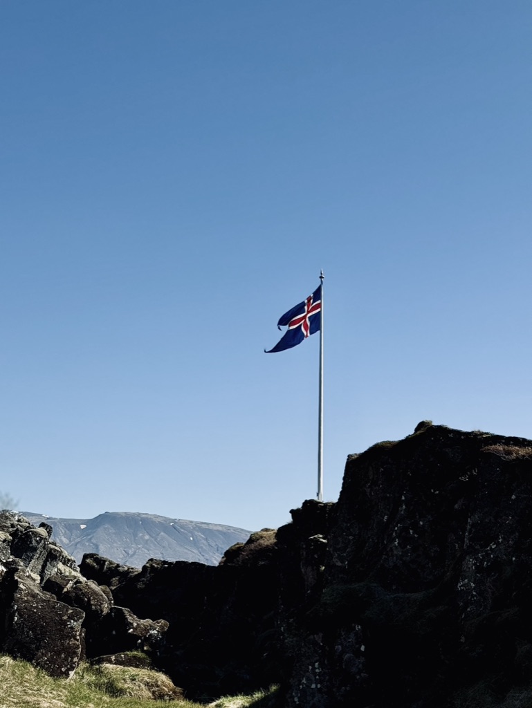 Icelandic flag on flag pole in Thingvellir National Park, Iceland