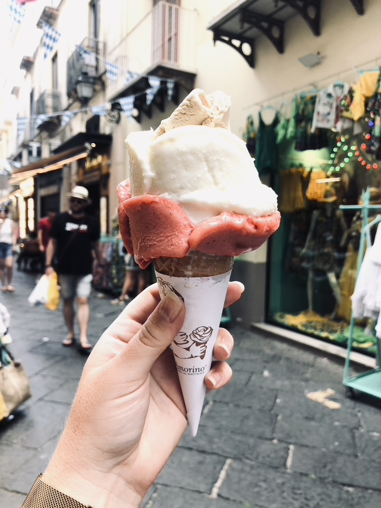 Hand holding rose shaped gelato in Sorrento, Greece