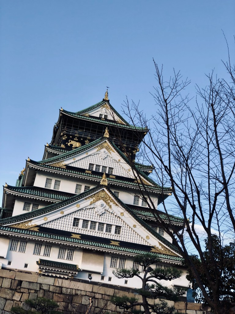 Osaka Castle with trees in Japan