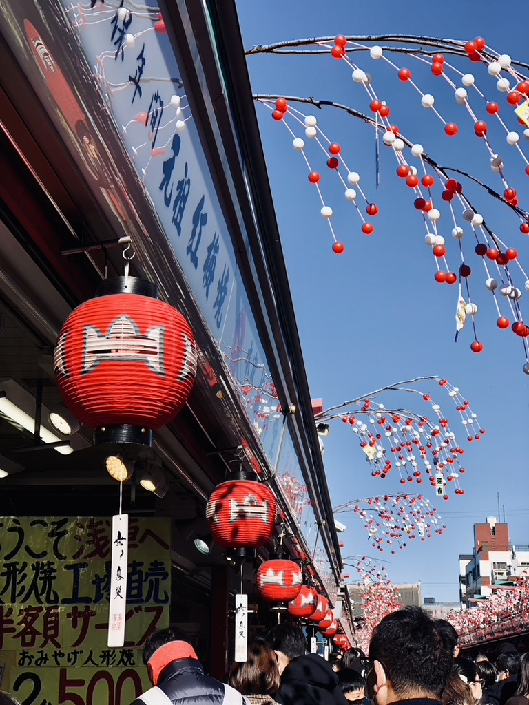 Red lanterns at market stalls in Nakamise Street at Asakusa, Tokyo, Japan.