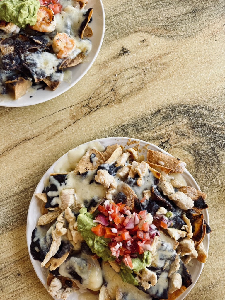 Nachos on a wooden table in Cozumel, Mexico