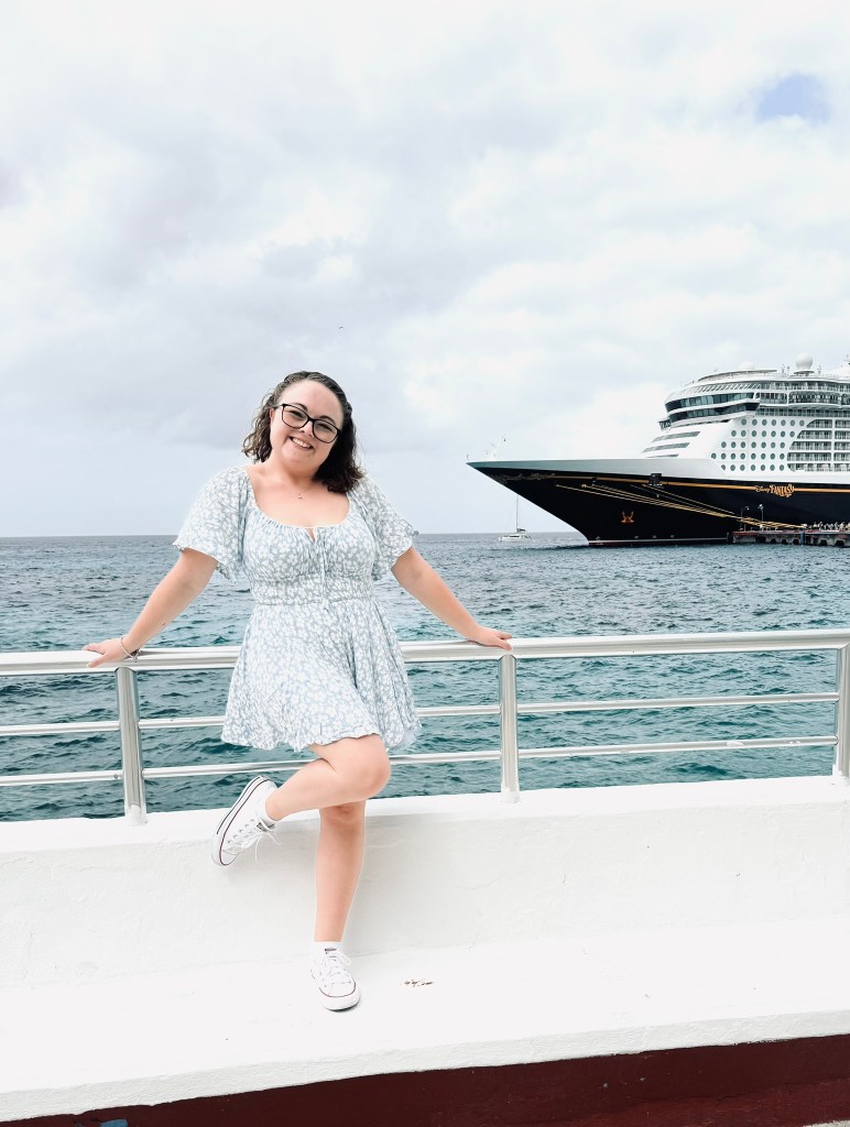 Girl in summer dress posing in front of a disney cruise ship in Cozumel, Mexico