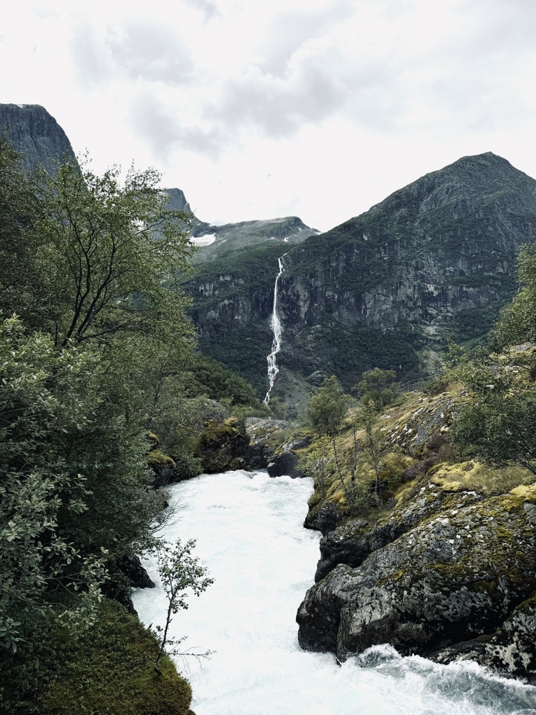 Beautiful mountains and waterfalls on hike to Briksdal Glacier, Norway