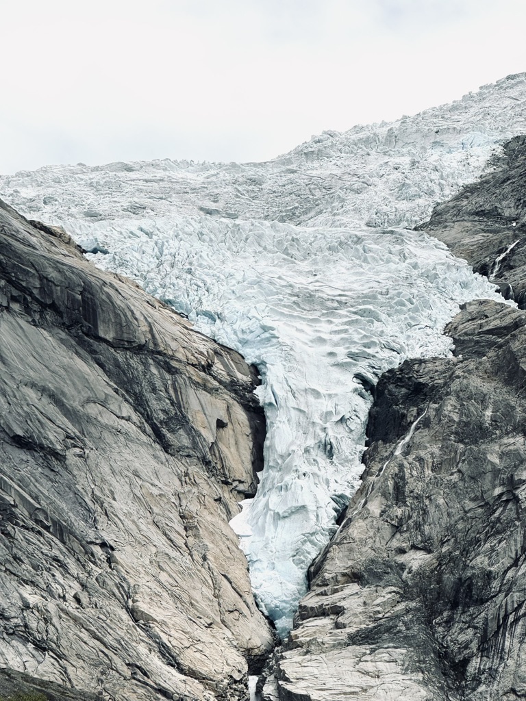 Close up of Briksdal Glacier, Norway with details of glacier ice on rocks.