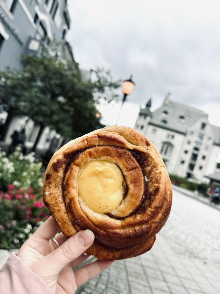 Hand holding Skoleboller (school bread), a famous Norwegian snack