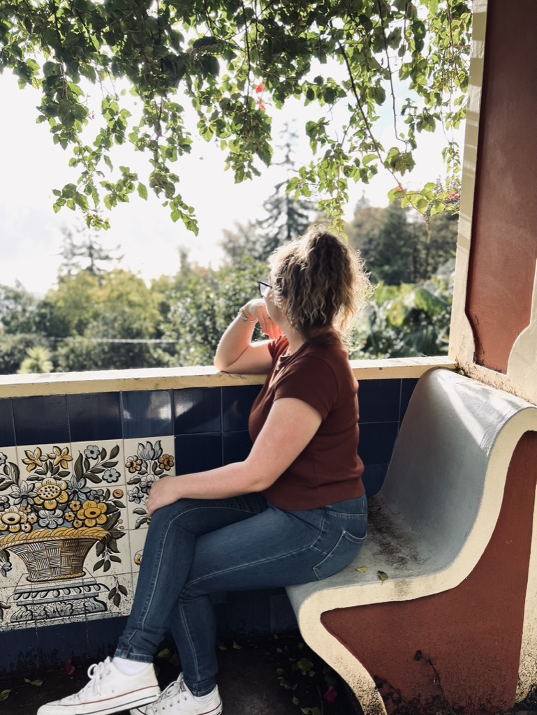 Girl looking out at view in a serene spot in Funchal, Portugal