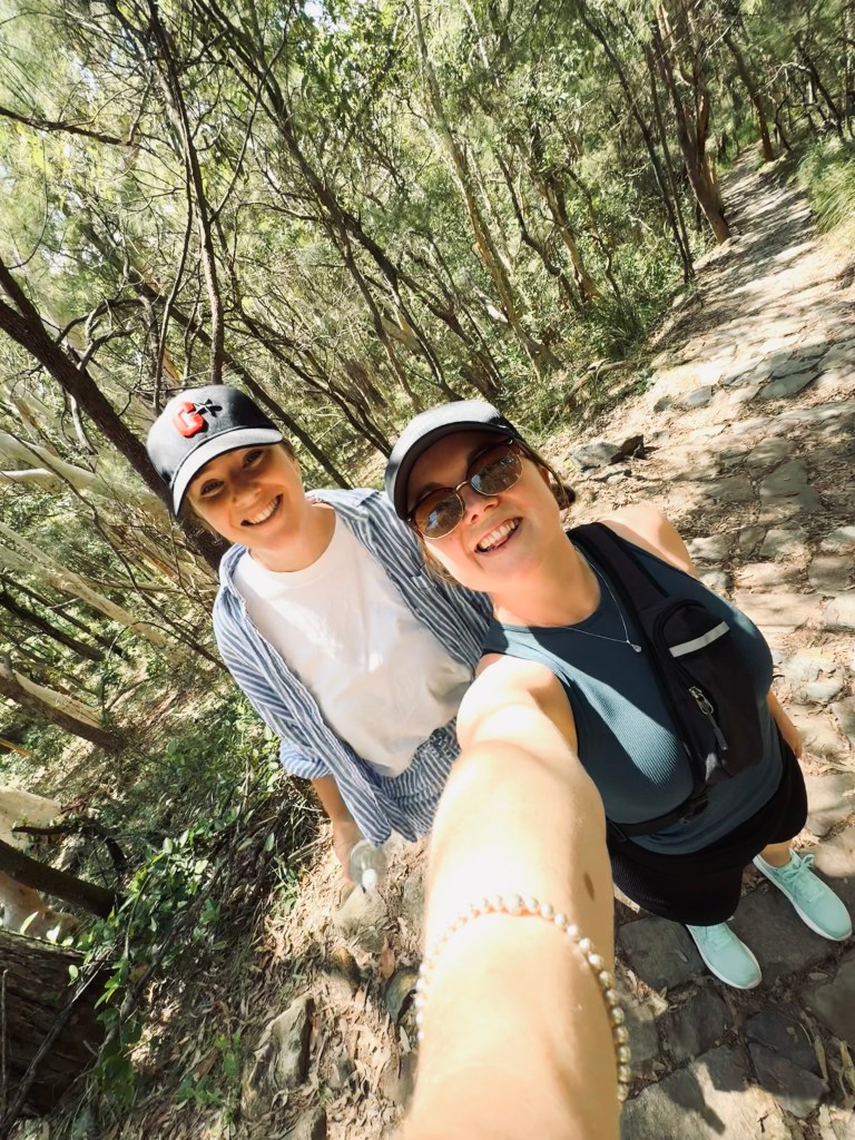 Two friends taking a selfie on the hiking trail at Mt Coolum, Sunshine Coast
