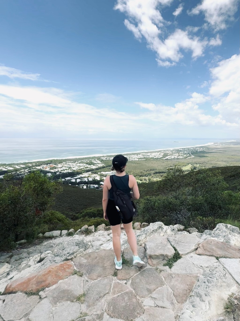 Girl looking out at the view from the summit of Mount Coolum National Park, Sunshine Coast