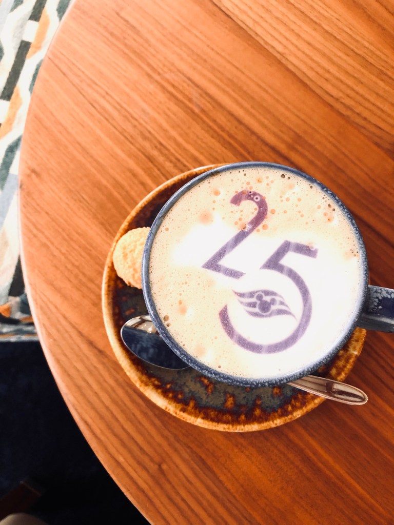 Disney Cruise Line coffee cup with 25th anniversary logo stamped on foam