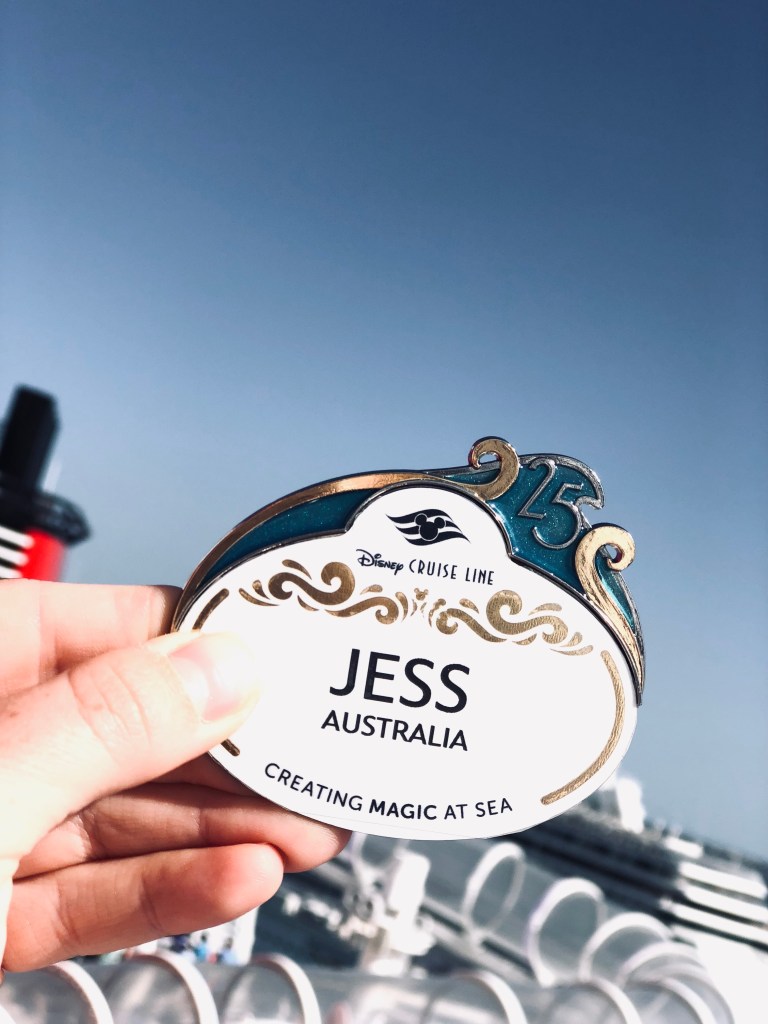 Disney Cruise Line crew member nametag with 25th Anniversary embellishment