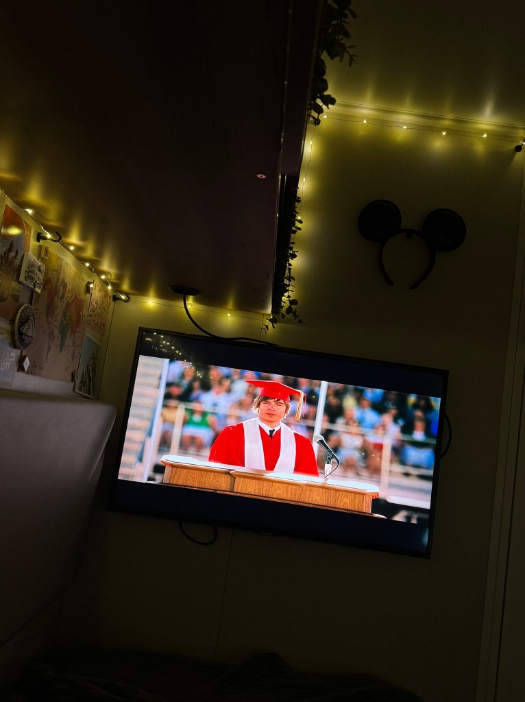 Crew Cabin onboard a Disney Cruise Ship at night with fairy lights and TV on