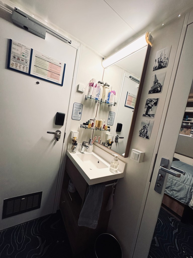 Crew Cabin onboard a Disney Cruise Ship - tight quarters with a sink in a shared bathroom cabin