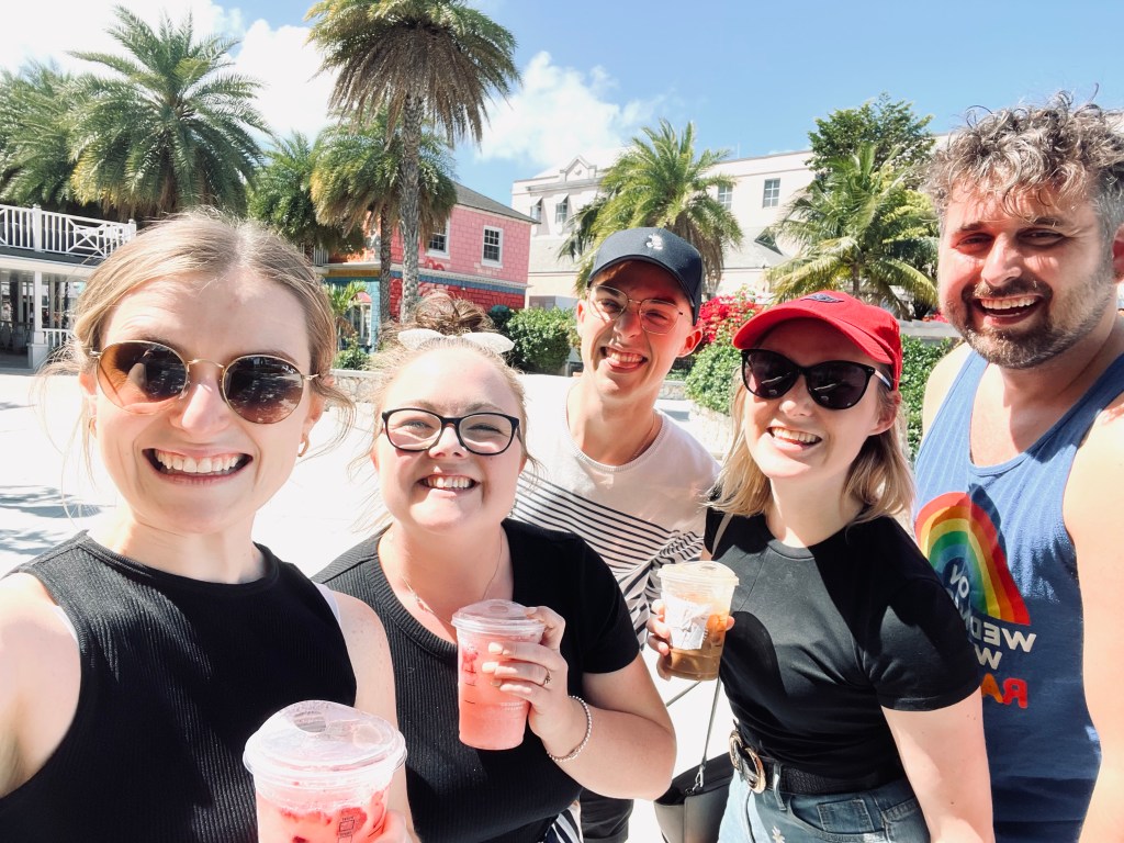 Friends taking selfie with starbucks cups in Nassau, Bahamas
