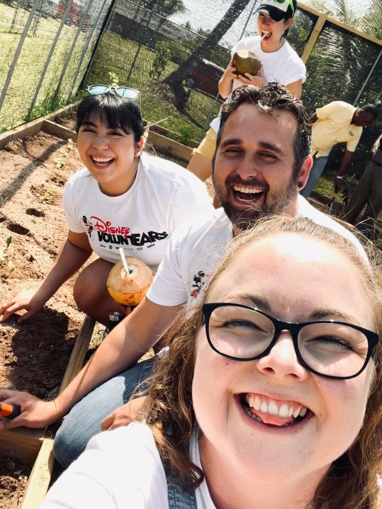 Disney crew members participating in voluntears event in a garden in nassau
