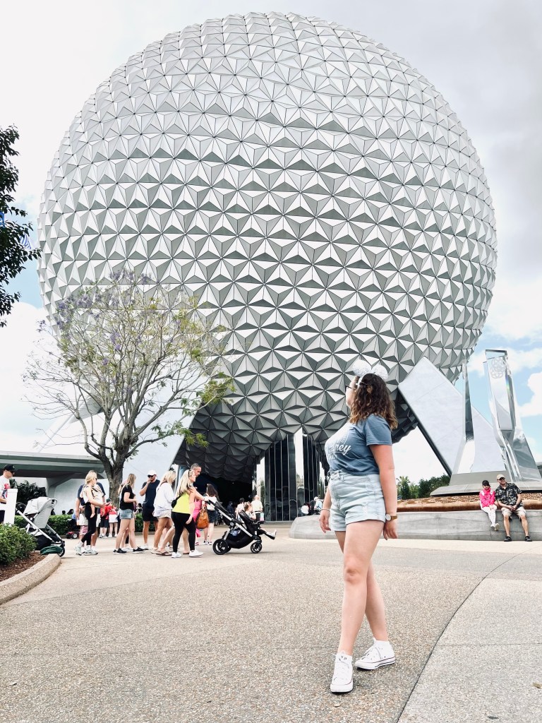 Girl looking back at Spaceship Earth at Epcot, Disney World