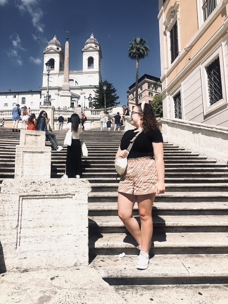 Girl looking back at Spanish Steps in Rome, Italy