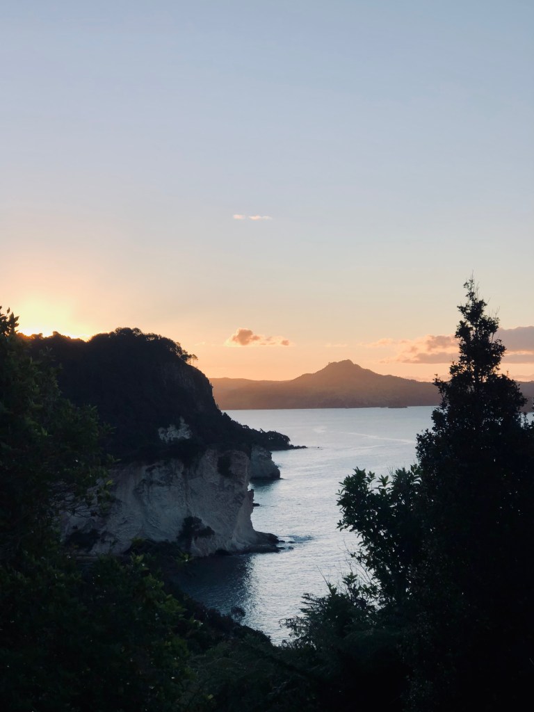 Sunset over Cathedral Cove in New Zealand