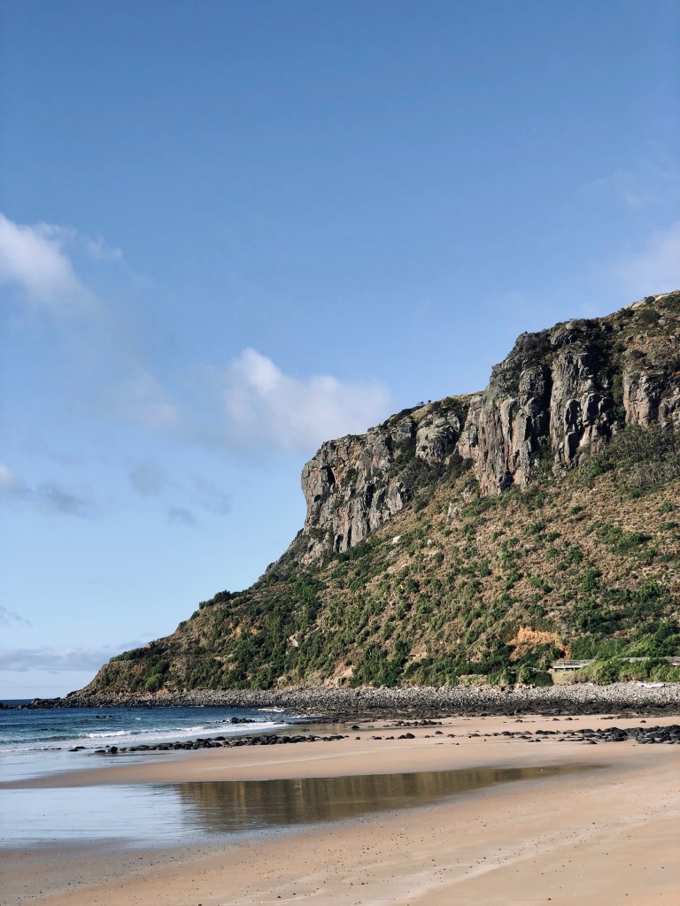 View of the cliffs of The Nut from the beach in Stanley, Tasmania
