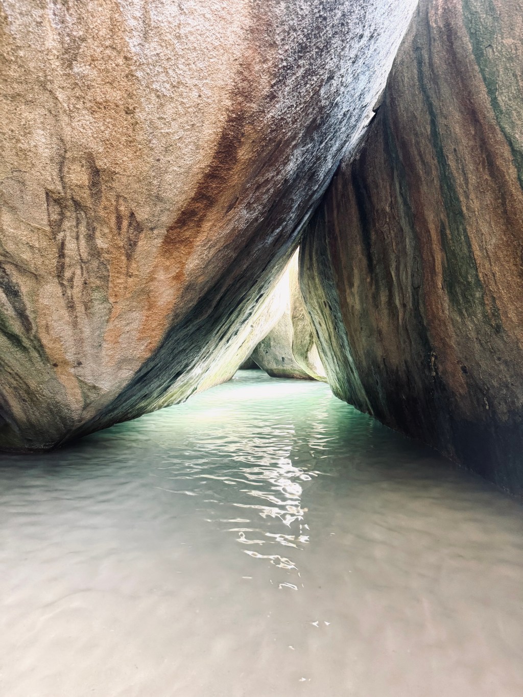 Caves forming a triangle entrance with water at The Baths Virgin Gorda