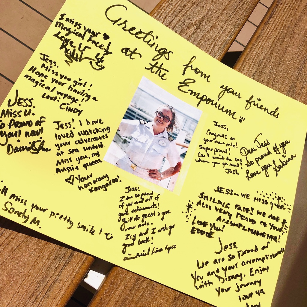 Poster with picture of Disney Cruise Line Crew Member dressed in Officer whites with signatures surrounding picture from old colleagues