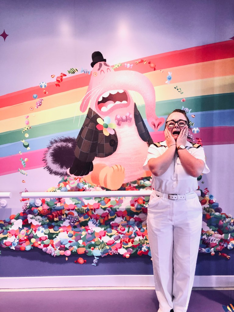 Disney Cruise Line officer pretending to be sad with Bing Bong at Joyful Sweets on disney cruise ship