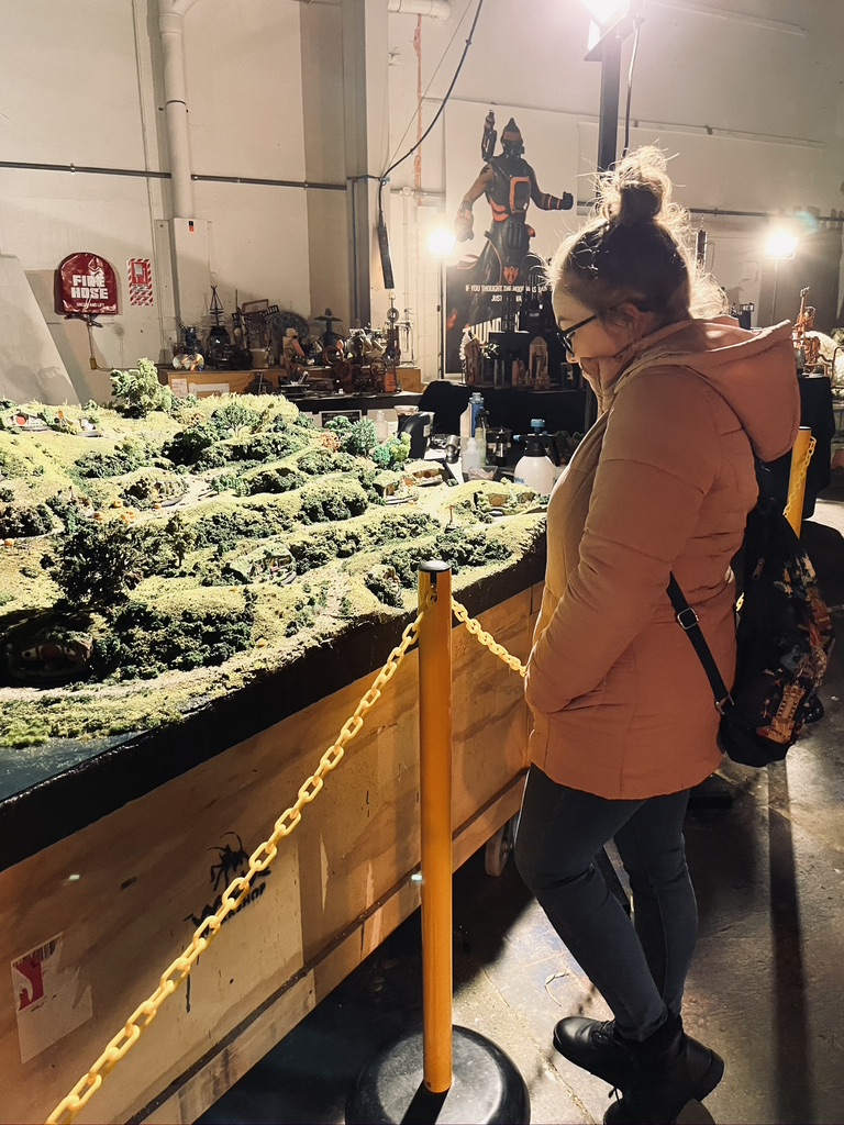 Girl looking at hobbit set at Weta Workshop in Wellington, New Zealand