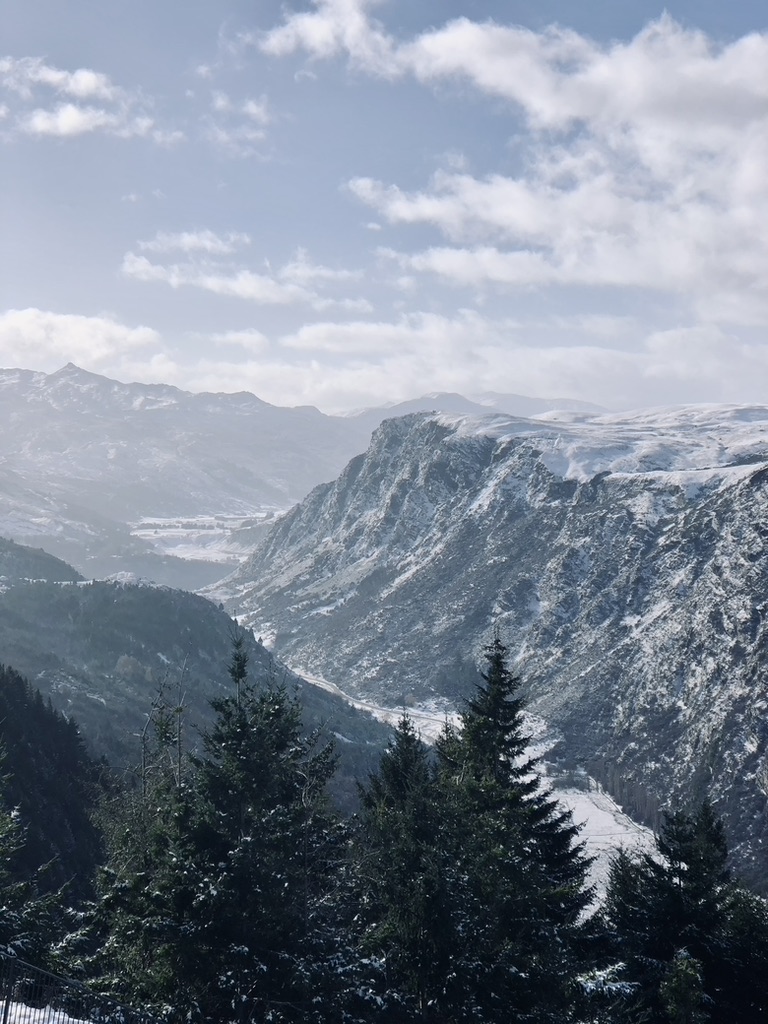 Stunning snow capped mountains on a sunny day in winter in Queenstown, New Zealand
