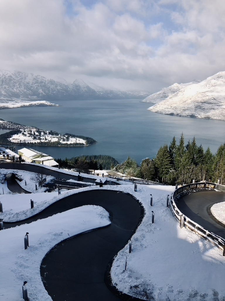 Luging track with lake and mountains in the background in Queenstown, New Zealand
