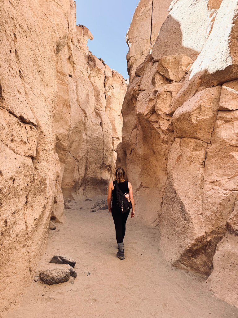 Girl walking through canyon in Arequipa, Peru