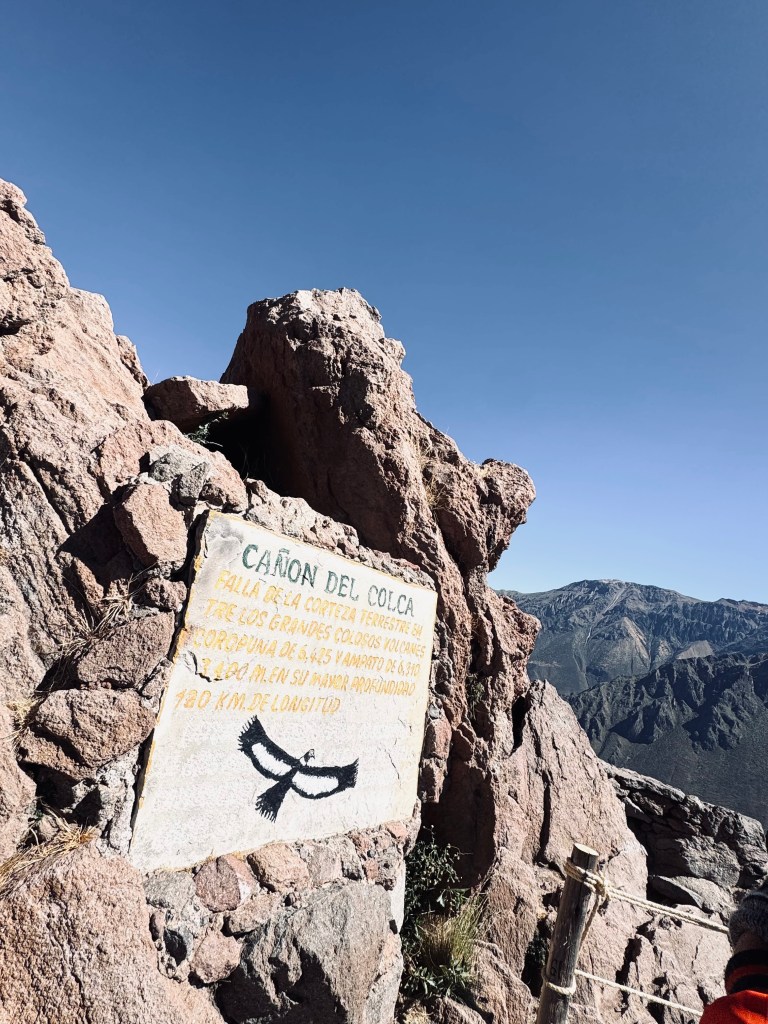 Sign about 'Canon del Colca' on rocks at Colca Canyon, Peru