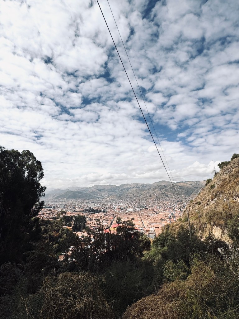 View of Cusco city from hill on a cloudy day in Peru