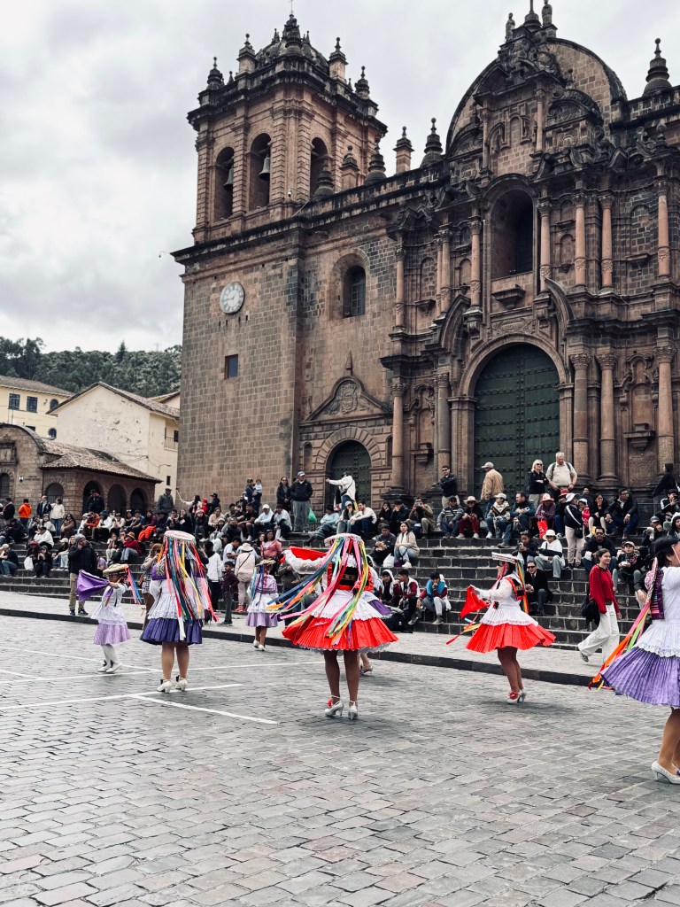 Parade with traditional peruvian dancers in Plaza de Armas in Cusco, Peru