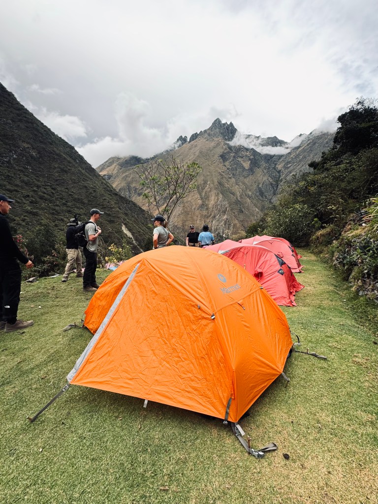Camp set up with tents and mountains in background on the Inca Trail, Peru