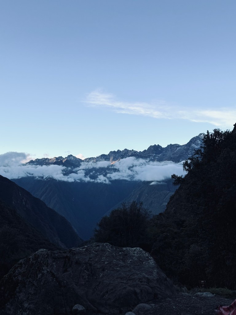 View of mountains with clouds from day two camping site on the Inca Trail in Peru