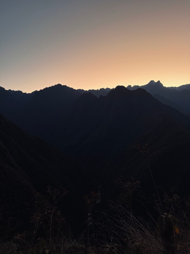 Sunrise behind the mountains on the last day of the Inca Trail in Peru