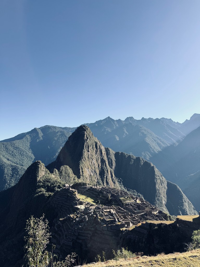 Iconic view of Machu Picchu city ruins on a perfectly clear day on the Inca Trail in Peru