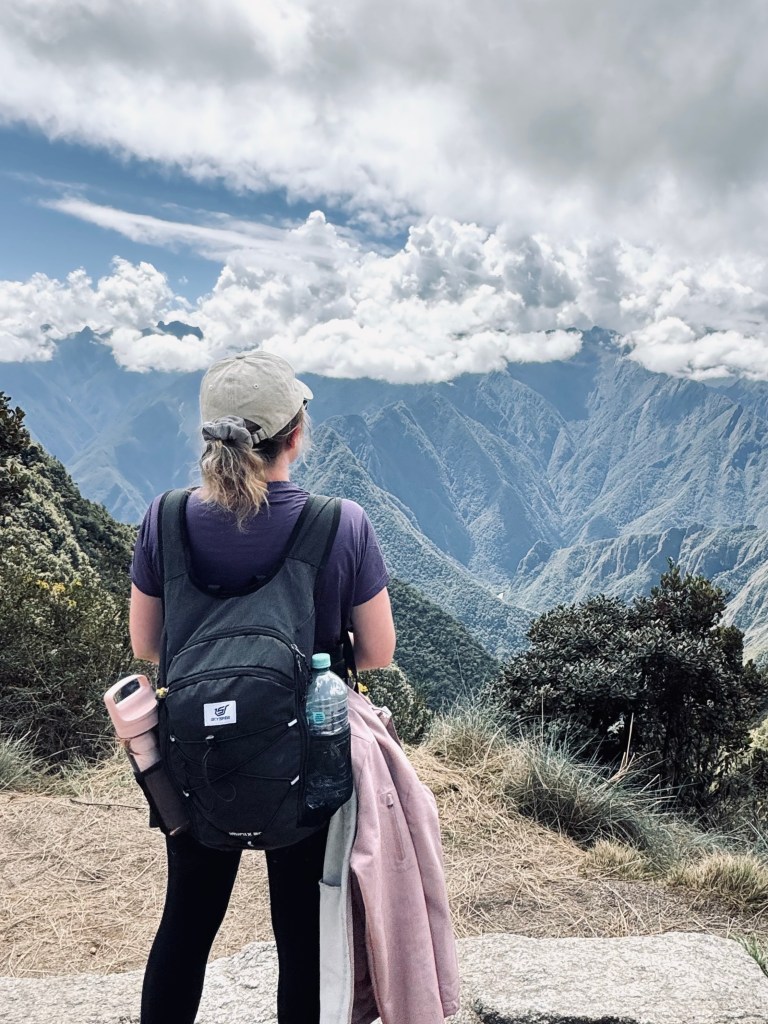 Girl looking out at Andes mountains on the Inca Trail in Peru